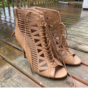 Tan bohemian woven and see through pump heels.